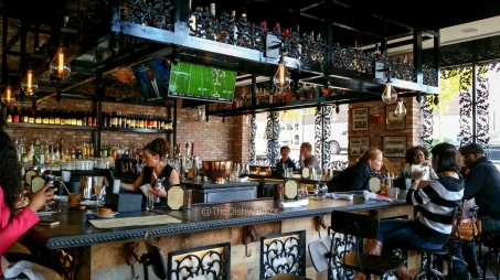 The beautiful wrought iron work can be found at the bar and frames the floor-to-ceiling windows.
